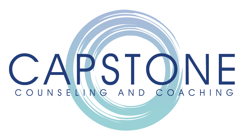 A logo for capstone counseling and coaching with a blue circle in the middle.