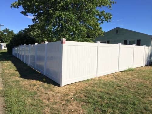 Vinyl Fence with Tree at Side — Fences in Springfield, MA Vinyl Fence with Tree at Side — Fences in Springfield, MA