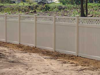 Vinyl Fence in the garden — Fences in Springfield, MA Vinyl Fence in the garden — Fences in Springfield, MA