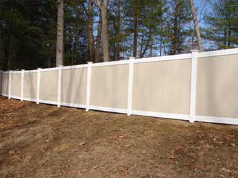 Vinyl Fence in the forest — Fences in Springfield, MA Vinyl Fence in the forest — Fences in Springfield, MA