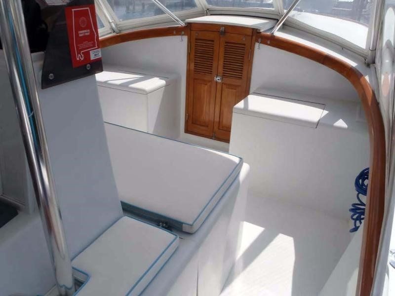The inside of a boat with a fire extinguisher on the wall