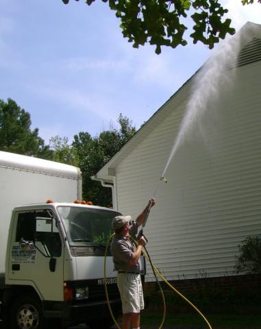 Free Estimates — Man Power Washing the Siding of House in Creedmoor, NC Free Estimates — Man Power Washing the Siding of House in Creedmoor, NC