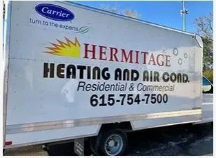 White truck side with “Hermitage Heating and Air Cond” logo, sun graphic, and phone number 615-754-7500