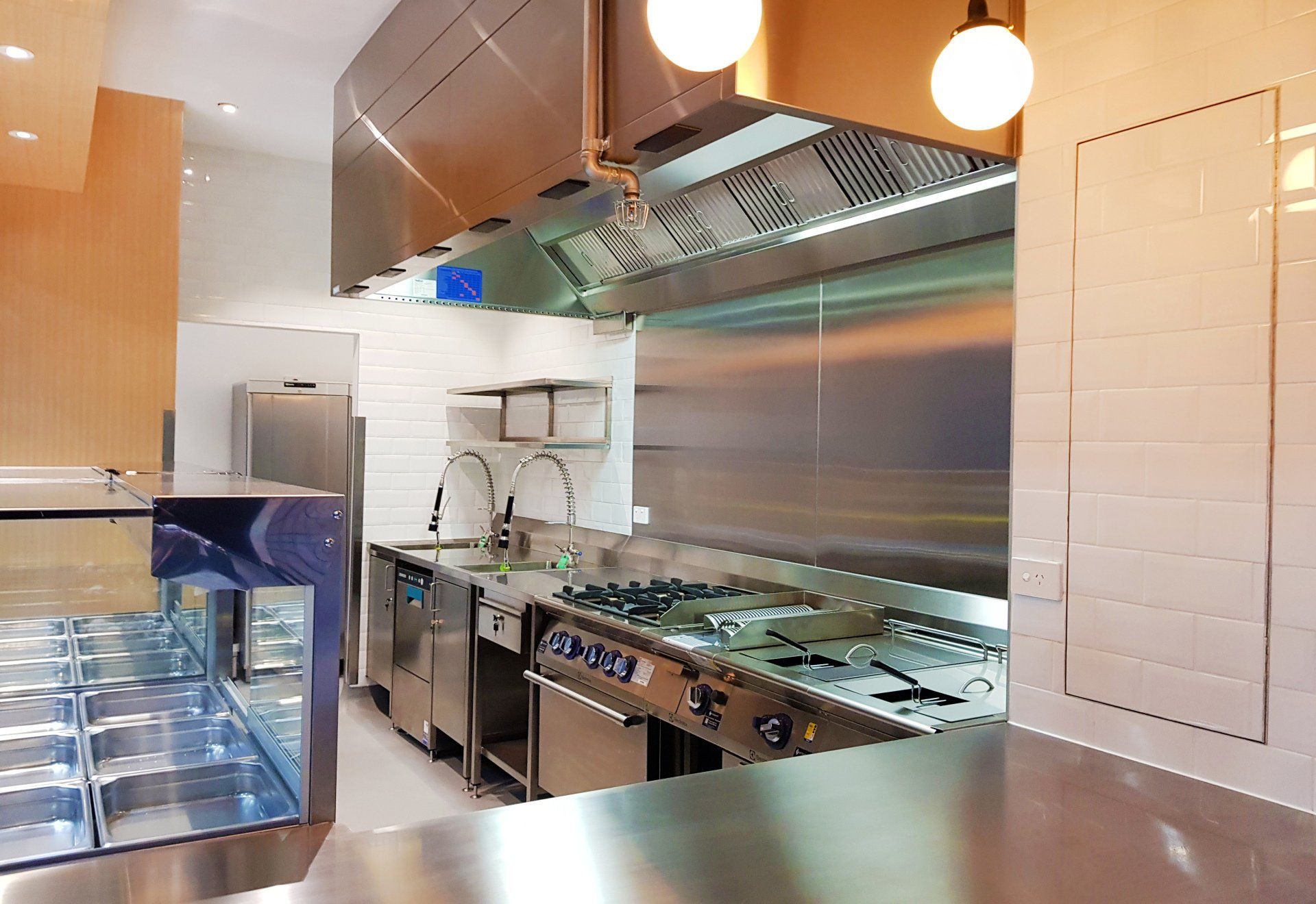 A kitchen with stainless steel appliances and a counter top