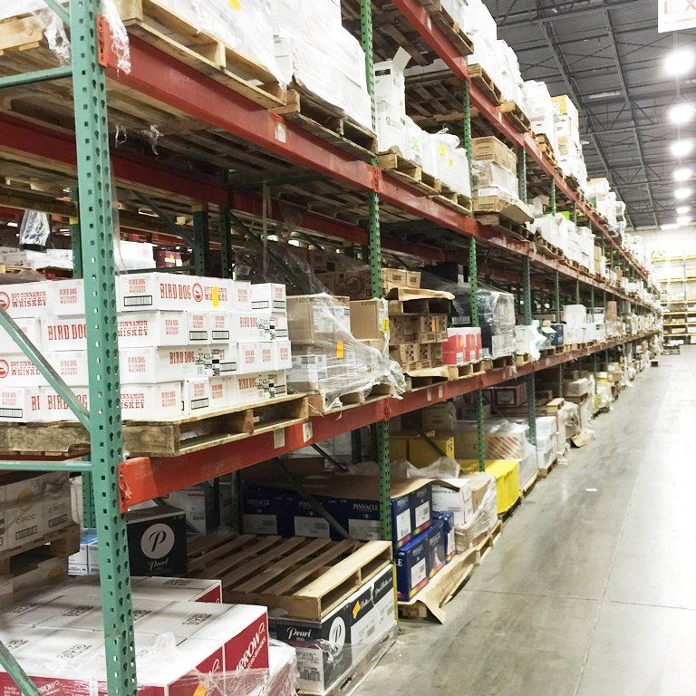 A warehouse filled with lots of boxes including one that says ' simpson ' on it