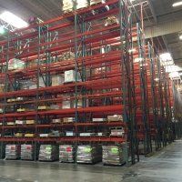 A large warehouse filled with lots of shelves and boxes.