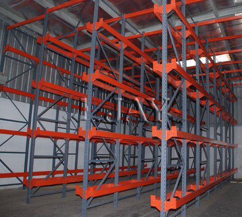A warehouse filled with lots of orange shelves