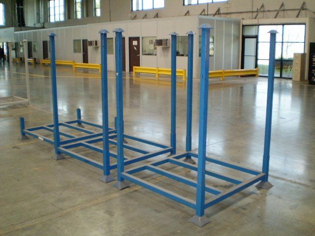 A row of blue metal racks in a warehouse