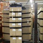A warehouse filled with lots of boxes and shelves.