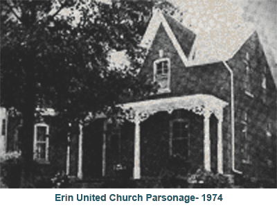 Erin United Church parsonage, 1974: black-and-white photo of a Gothic house with porch and trees