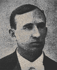 Black-and-white portrait of a man in a suit and tie, looking slightly to the side.