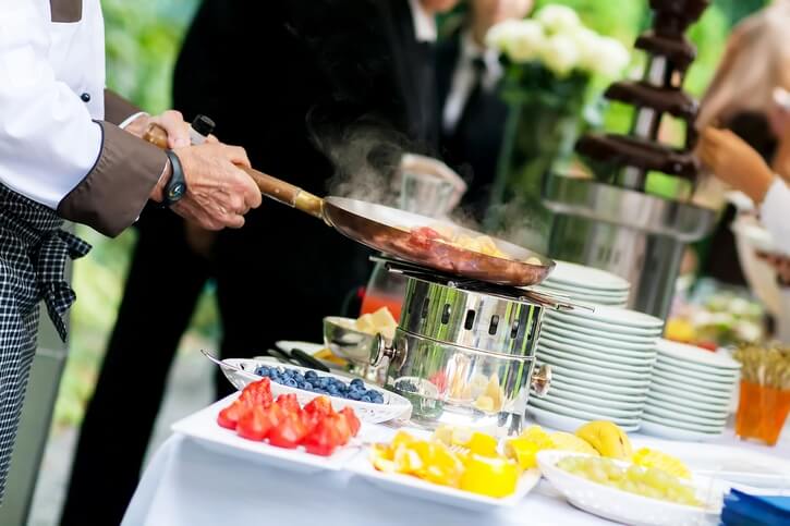 Chef Reheating the Food — Newtown, PA — Piccolo Trattoria Italian Catering