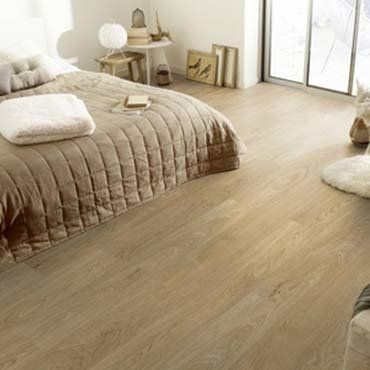Bedroom Interior with Laminate Flooring — Ypsilanti, MI — Carpet Center & Floors Bedroom Interior with Laminate Flooring — Ypsilanti, MI — Carpet Center & Floors