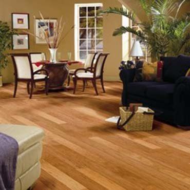 Custom Carpet — Wooden Floor with Couch and Chairs in Ypsilanti, MI