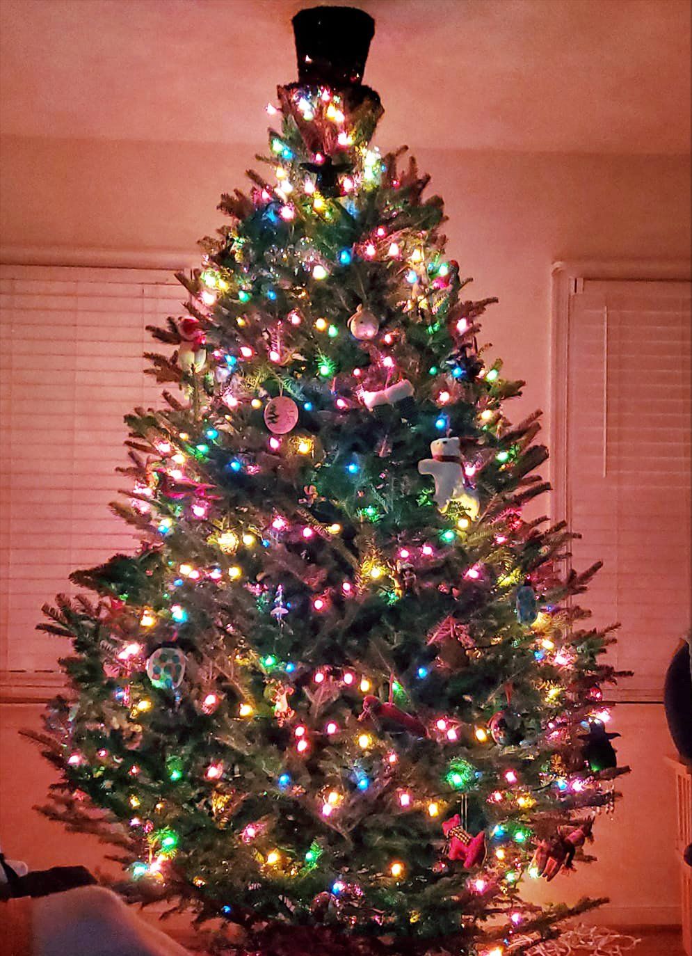 A christmas tree with lots of lights and decorations