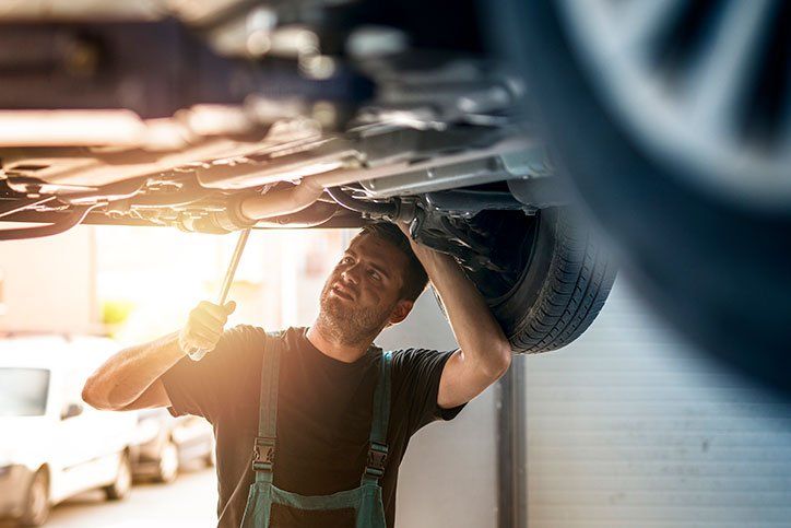 Mechanic Repairing the Automobile — Elmira, NY — Steve's American Lifetime Muffler