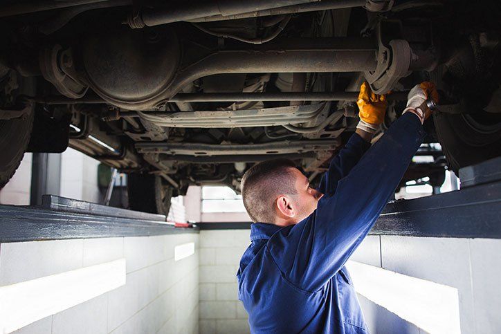 Mechanic Repairs the Car Suspension — Elmira, NY — Steve's American Lifetime Muffler