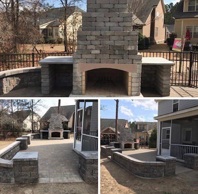 A brick fireplace in the backyard of a house