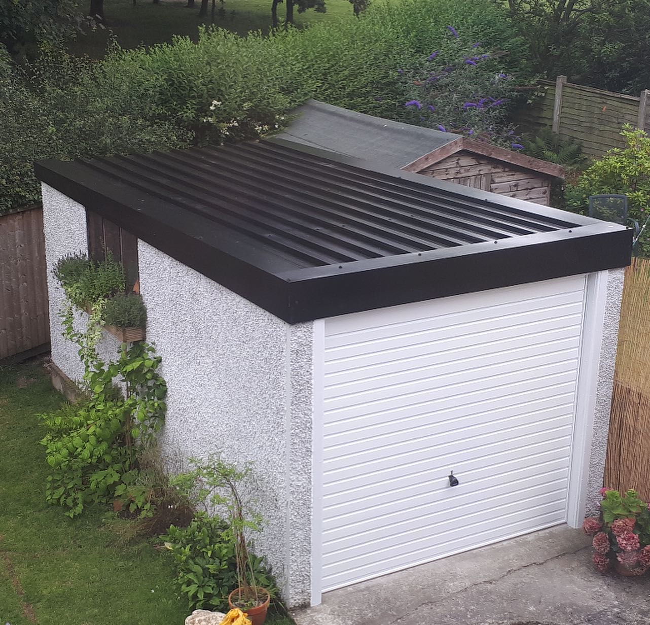 New grey corrugated roof on garage