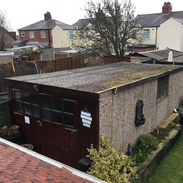 Old garage with brown trim