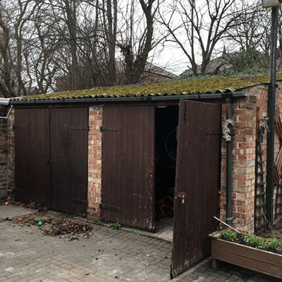 Twin garage with open door on one