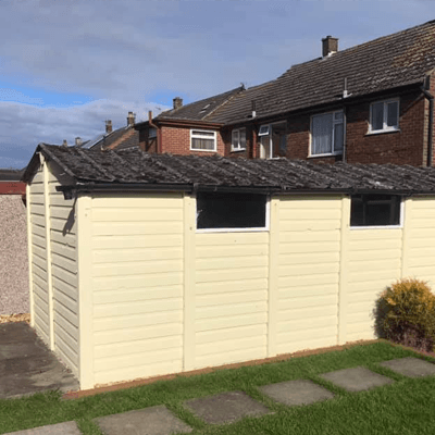 Side-on image of white garage