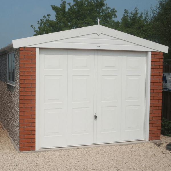 White garage with brick fronts