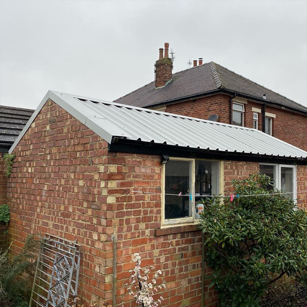 Brick garage with tilted sheet roof