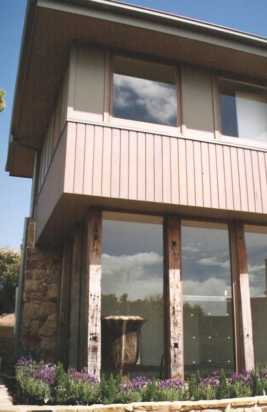 house with tall windows on the first level