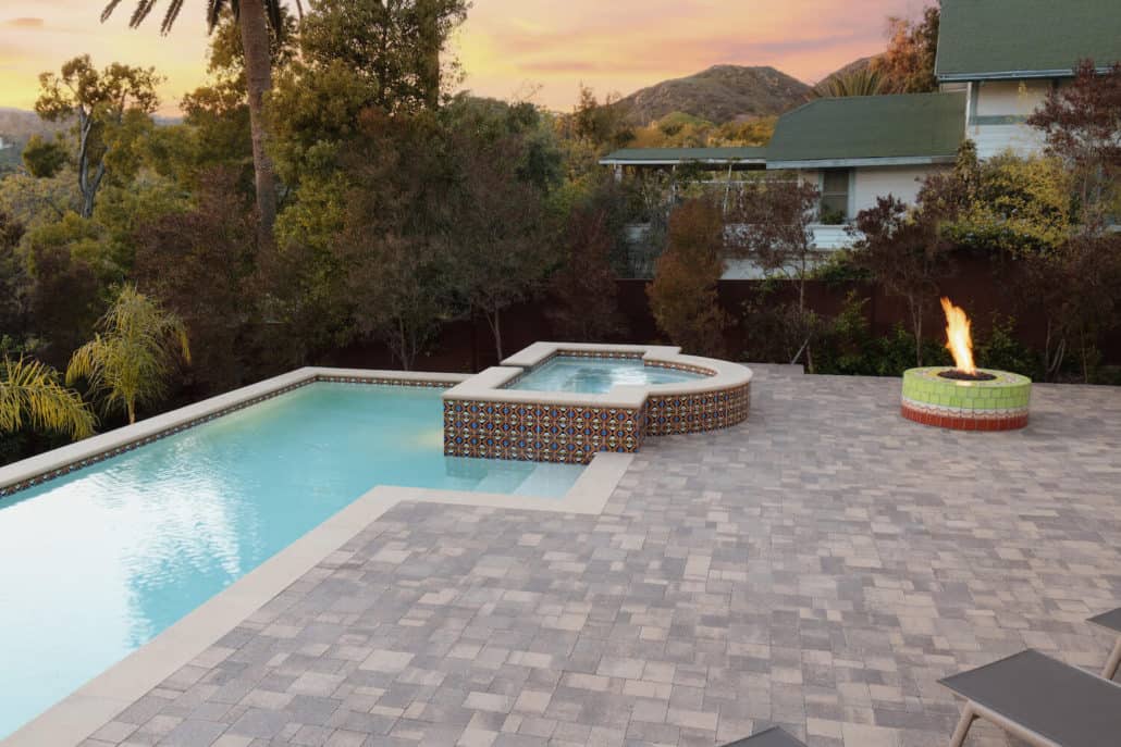 There is a fire pit in the middle of the pool.