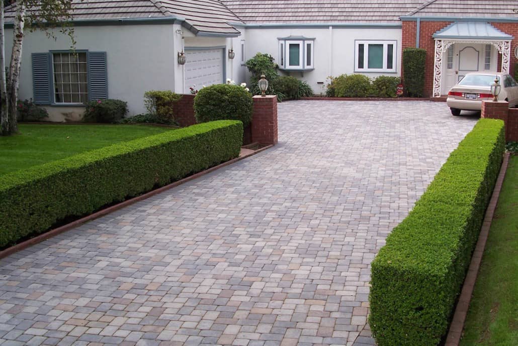 A car is parked in the driveway of a house