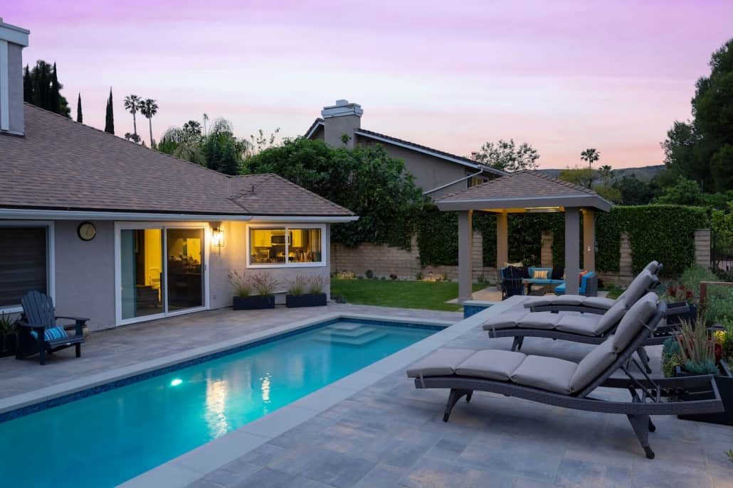 A house with a large swimming pool in the backyard