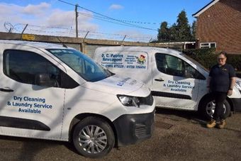 2 service vans with worker