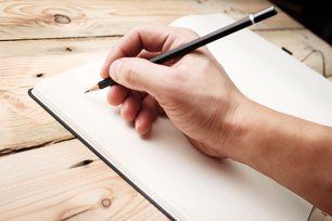 A man with an empty notebook