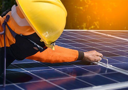 Workers Installing Solar Panel — Danville, IL — Schomburg & Schomburg Construction Incorporated