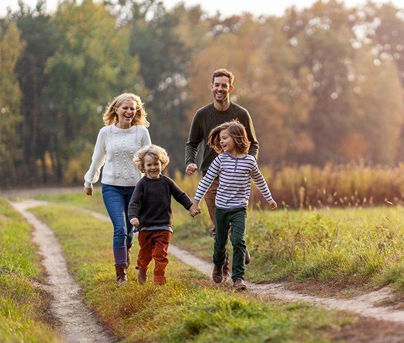 Young Family Having Fun Outdoors — Elkhart, IN — Maryellen Baker Attorney at Law Young Family Having Fun Outdoors — Elkhart, IN — Maryellen Baker Attorney at Law