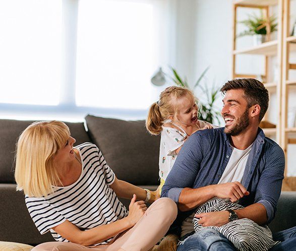 Family of Three Playing Together at Home — Elkhart, IN — Maryellen Baker Attorney at Law Family of Three Playing Together at Home — Elkhart, IN — Maryellen Baker Attorney at Law