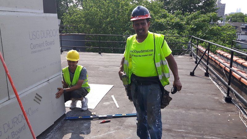Roofing contractor installing new roof 