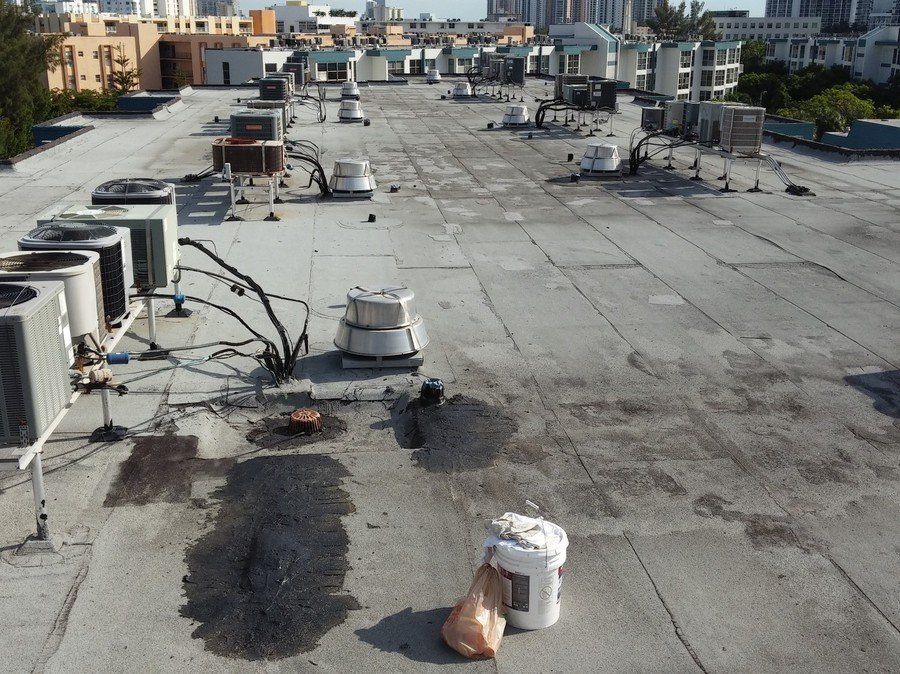 a roof with a lot of air conditioners on it