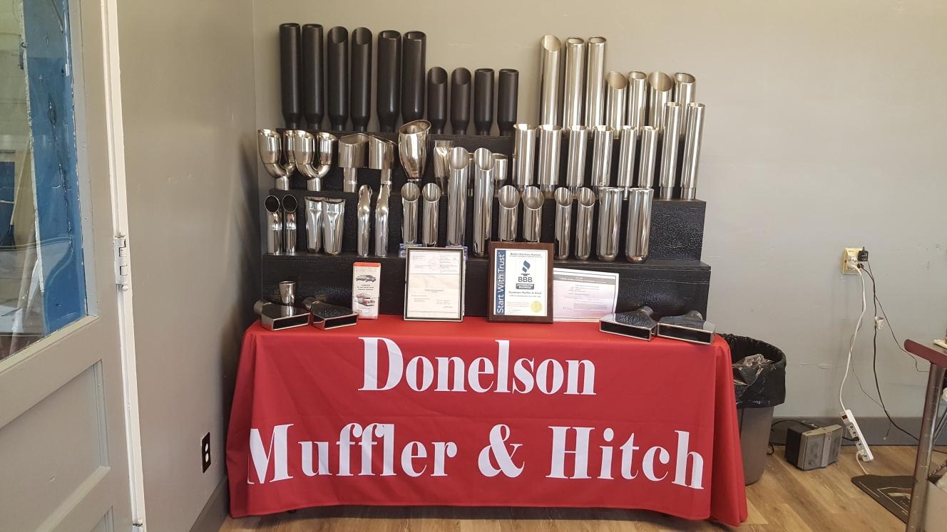 Inspecting Car Muffler — Nashville, TN — Donelson Muffler & Hitch Inspecting Car Muffler — Nashville, TN — Donelson Muffler & Hitch