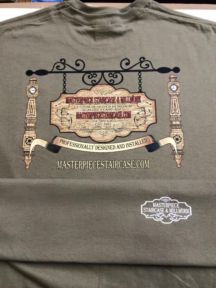Back of an olive green t-shirt with a vintage-style sign design.