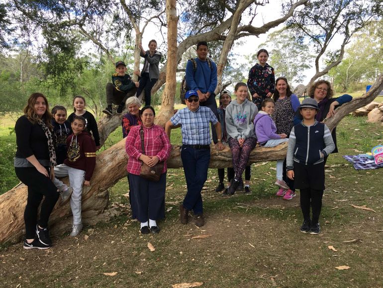 team standing around a tree