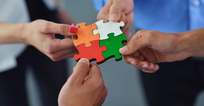 People putting together a puzzle