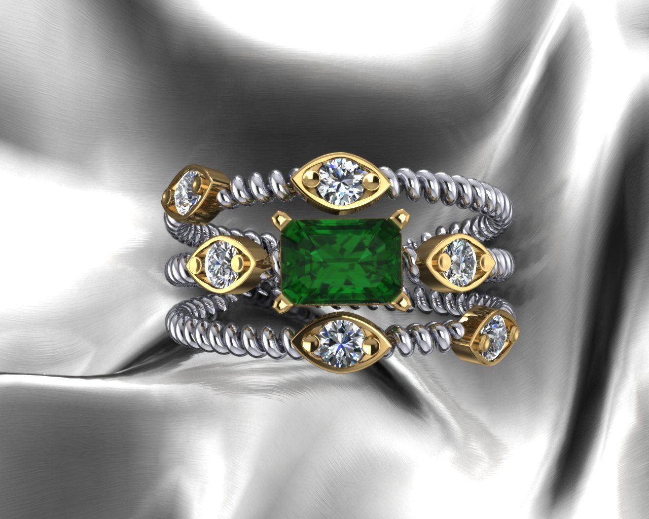 Emerald and diamond ring with twisted gold and silver bands, on a silver cloth.