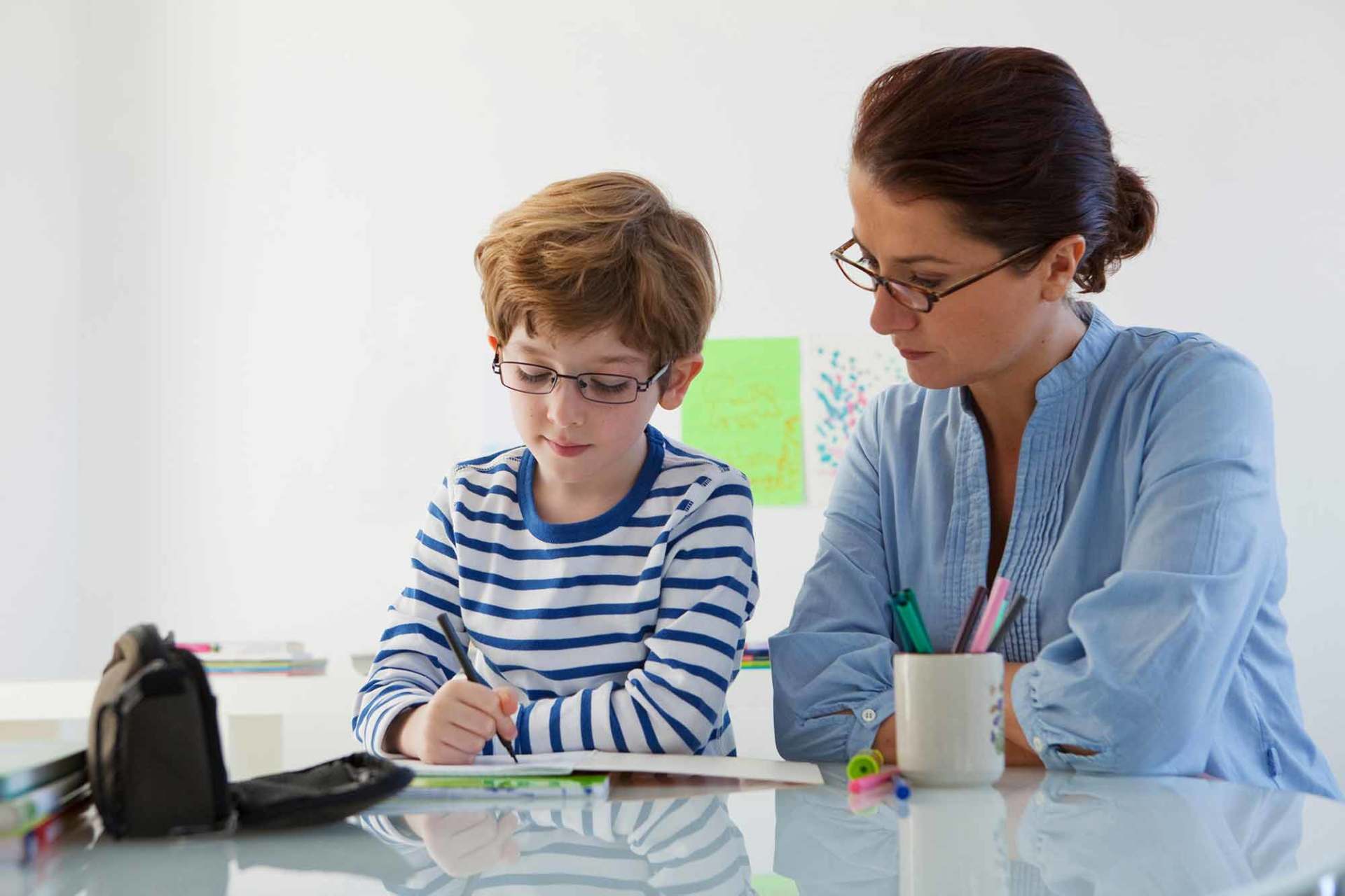 Teacher helping students
