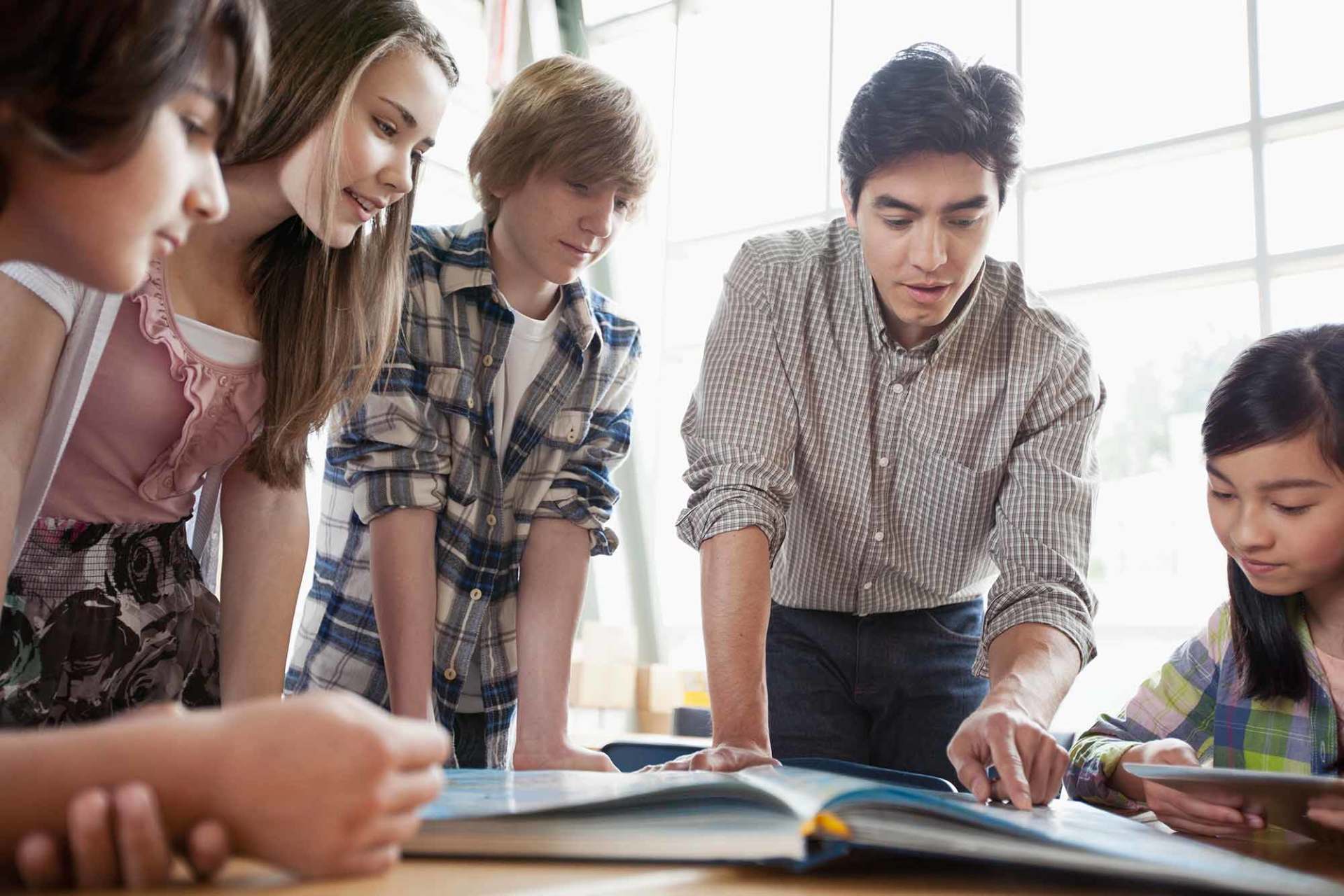 Teacher assisting students in class
