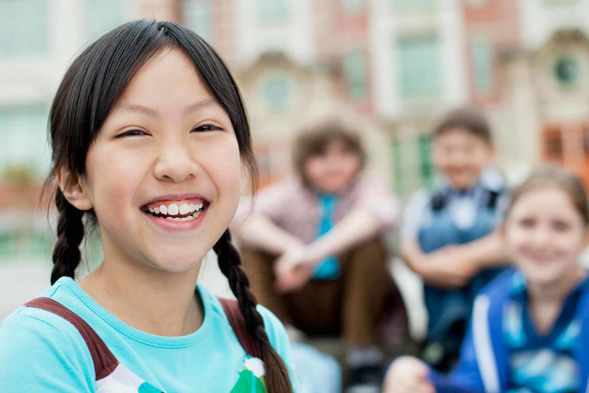 Elementary students outside of school building