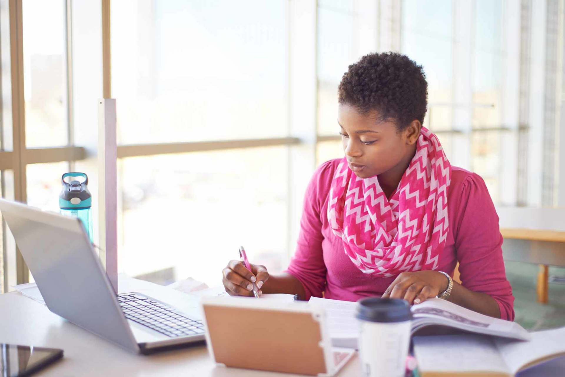 Cropped shot of a young female college student studying