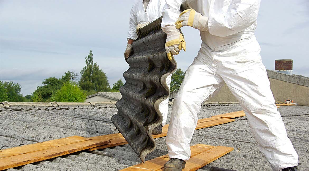 Asbestos Removal by a Worker in A white Protective Suit - Asbestos Removal Near Darwin