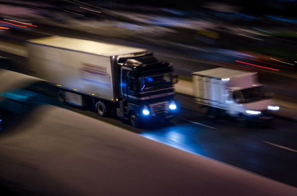 Semi Truck and Smaller Semi Truck on Highway